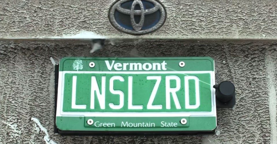 License Plate Mounted Backup Camera Cleaner Conceals Itself for Stealthy Cleaning